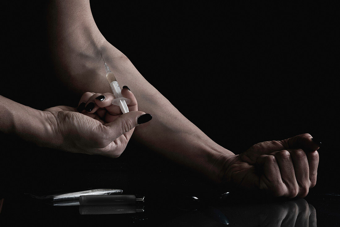 Woman injecting heroin