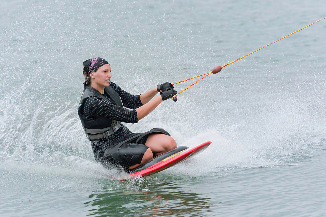 Woman kneeboarding