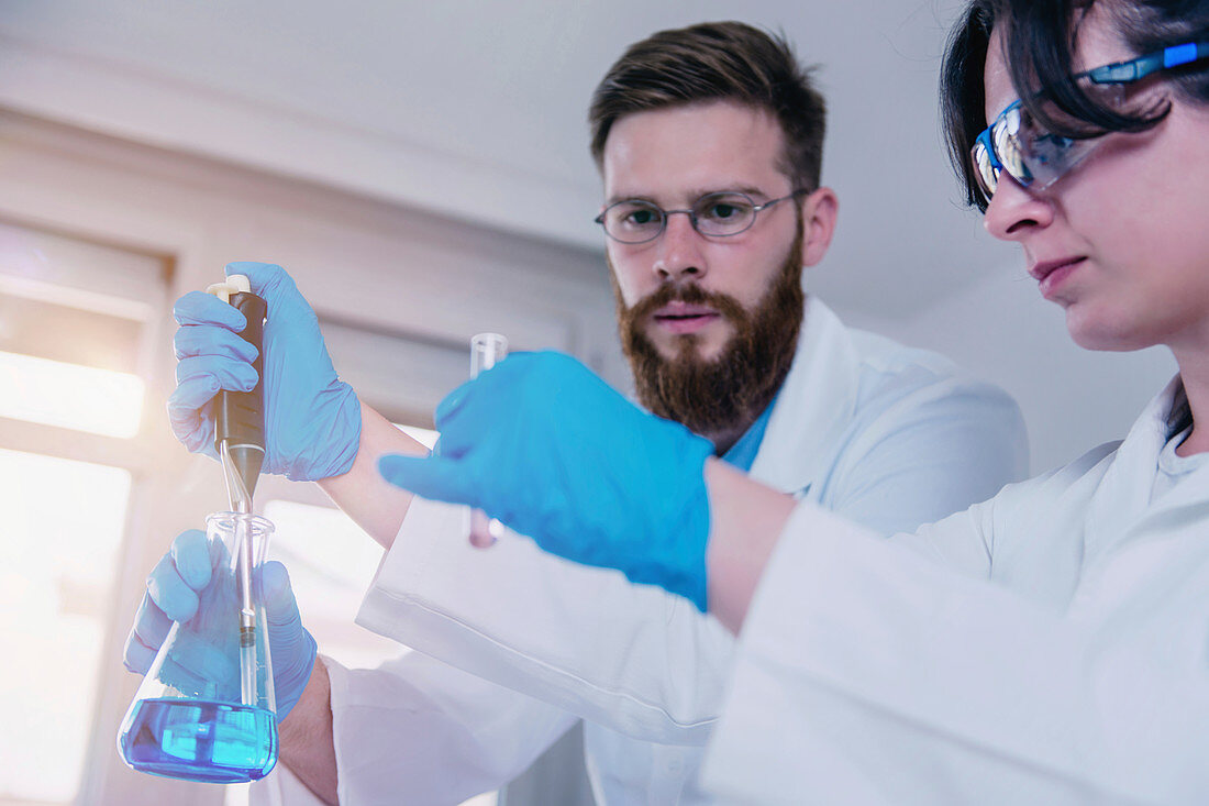 Researcher using micropipette