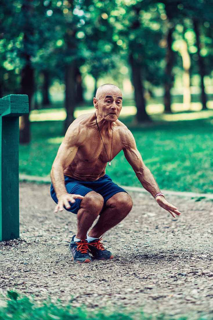 Fit senior man exercising in a park