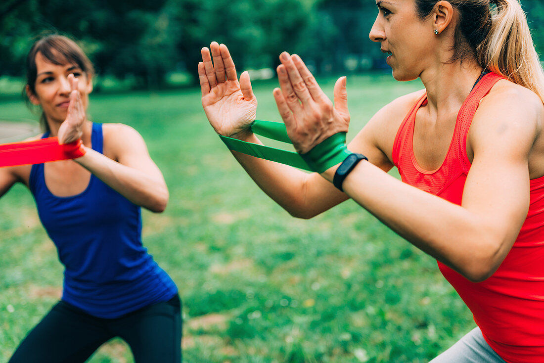 Women exercising with elastic bands