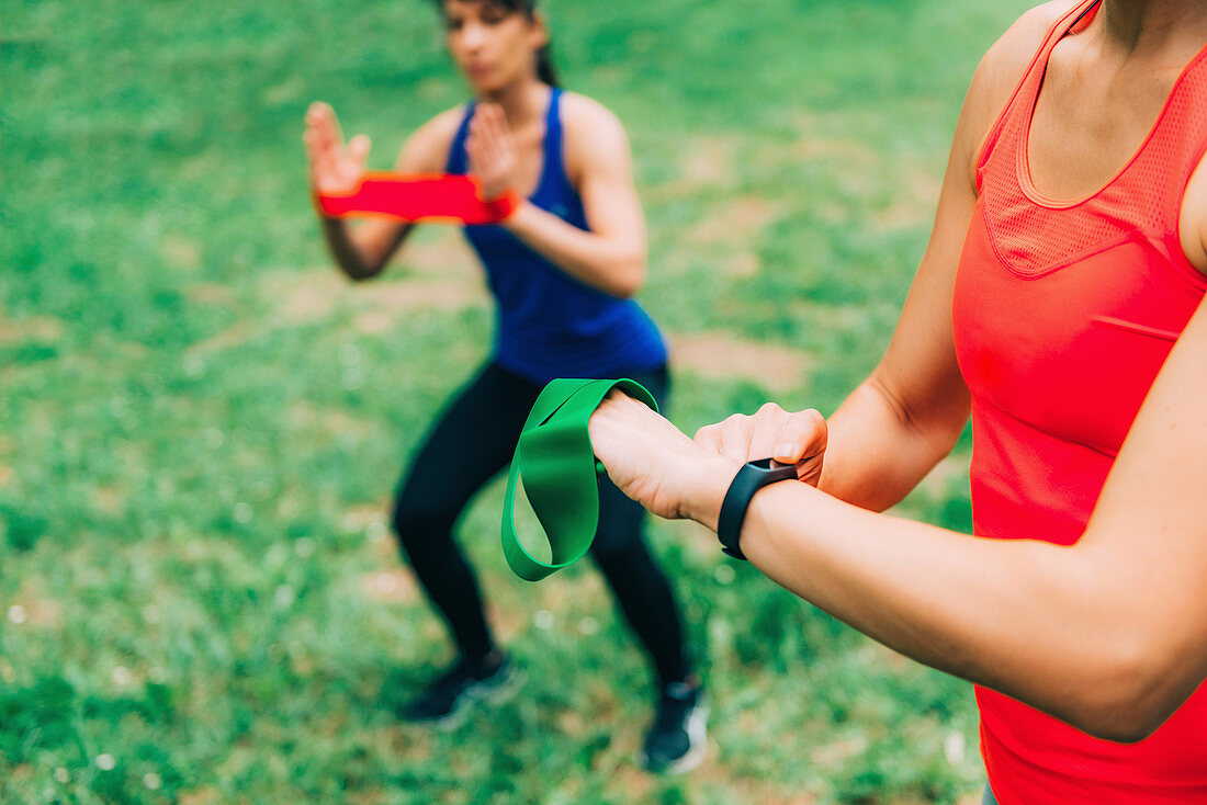 Woman looking at smartwatch after outdoor training