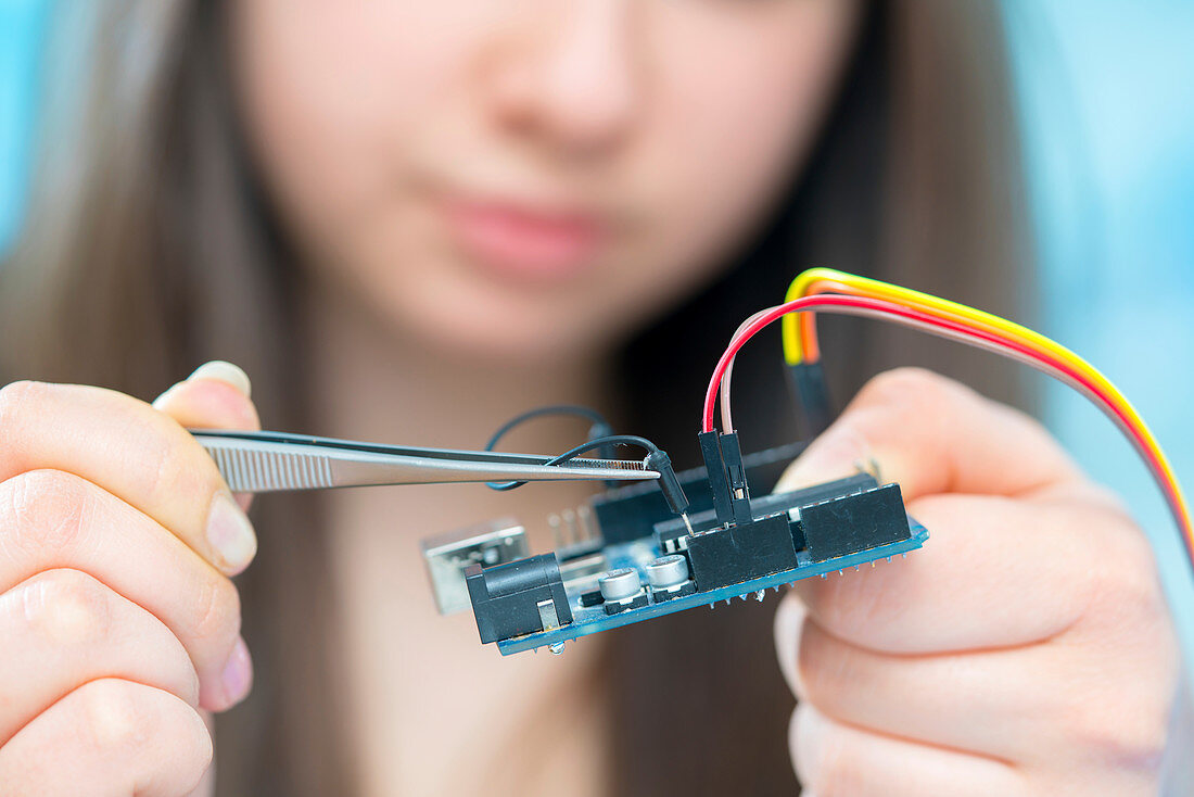 Girl working on electronics project