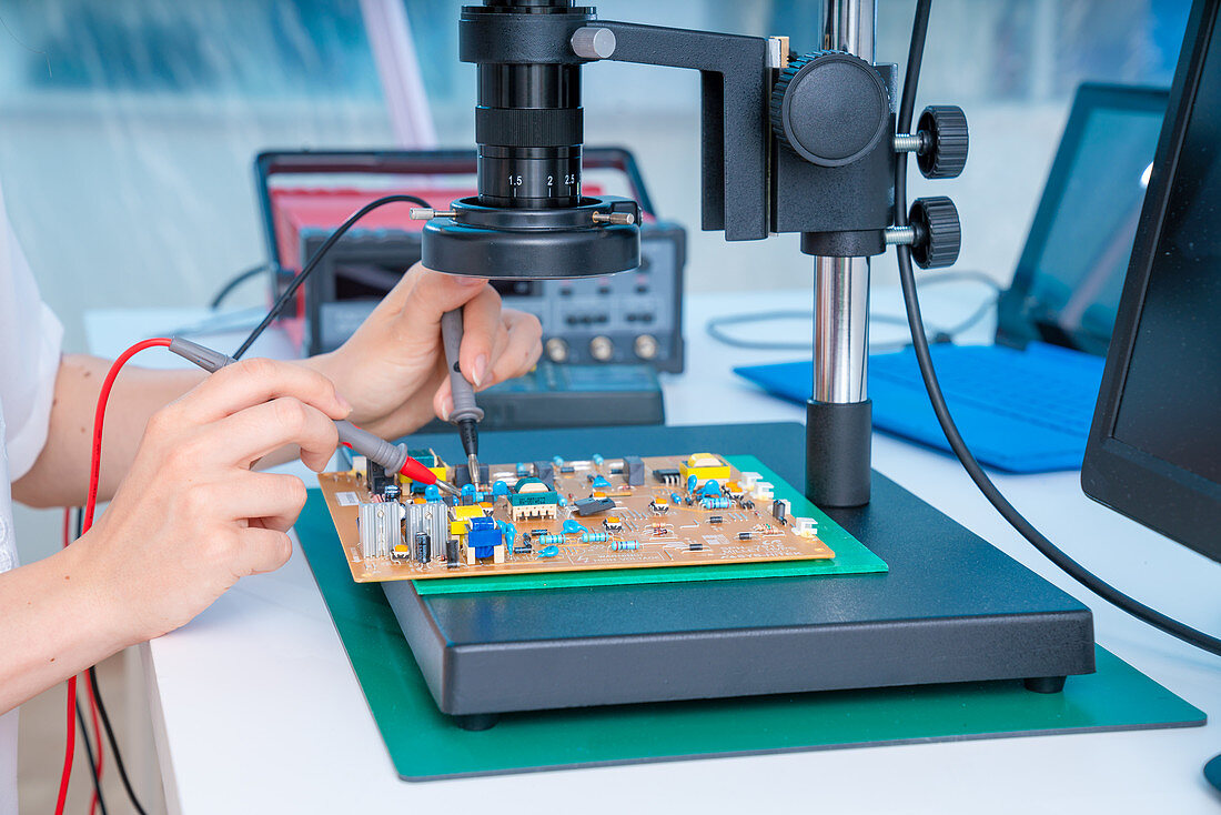 Engineer working on circuit board