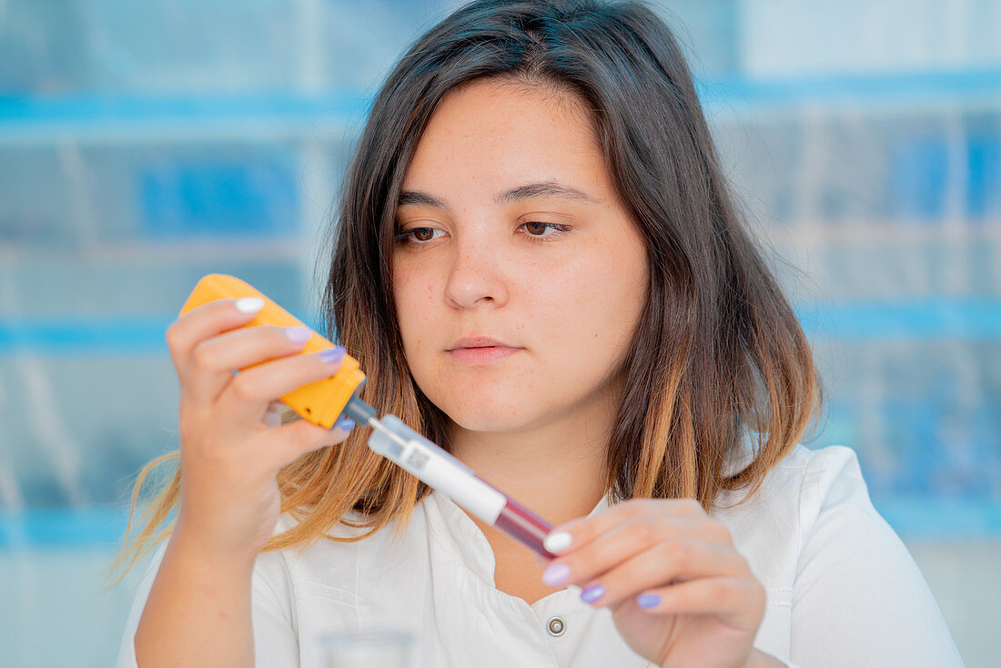 Testing wine in quality control lab