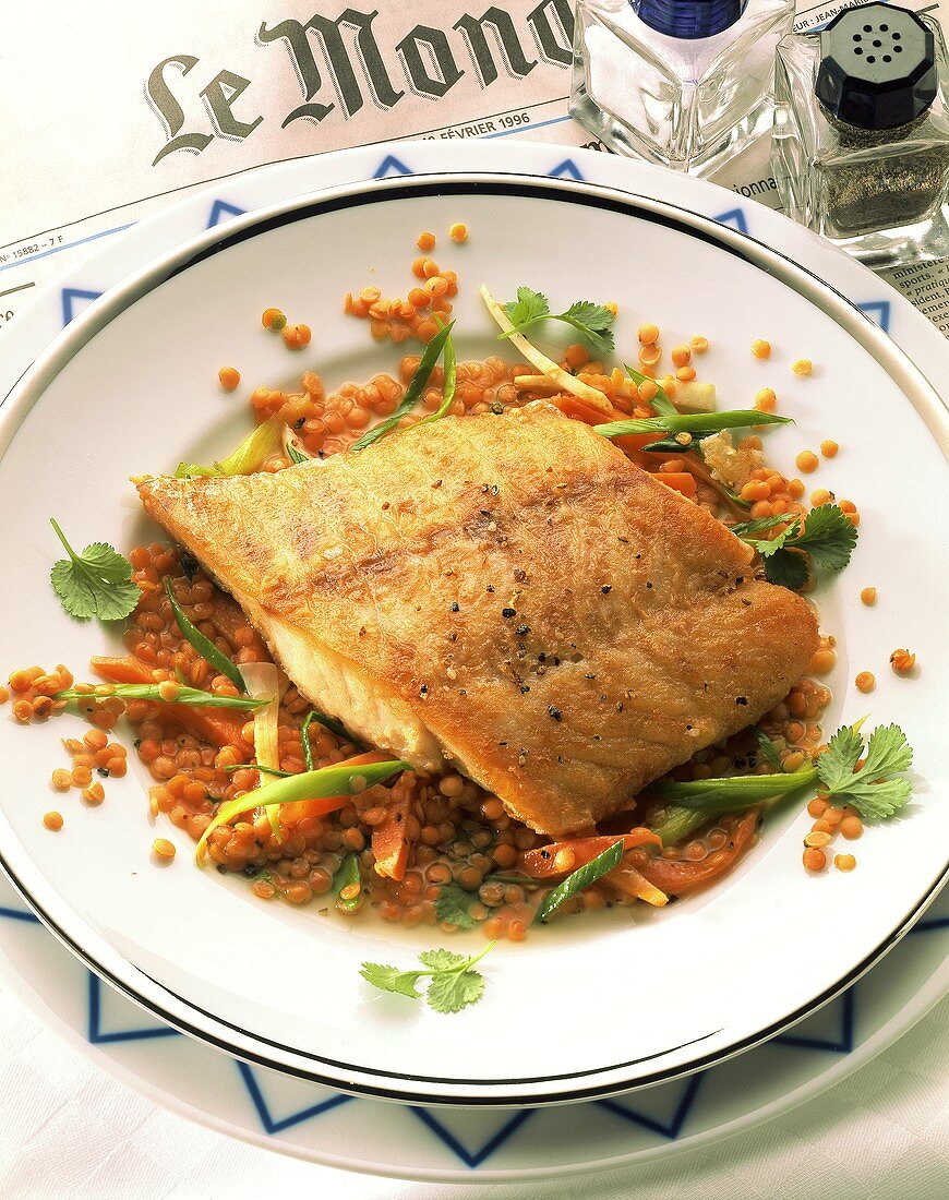 Nile perch on red lentils