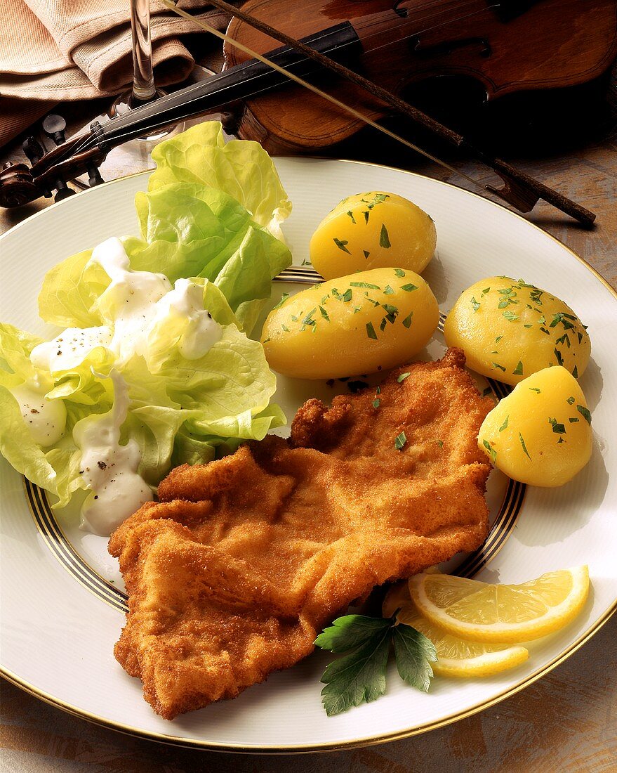 Wiener Schnitzel with lettuce and boiled potatoes