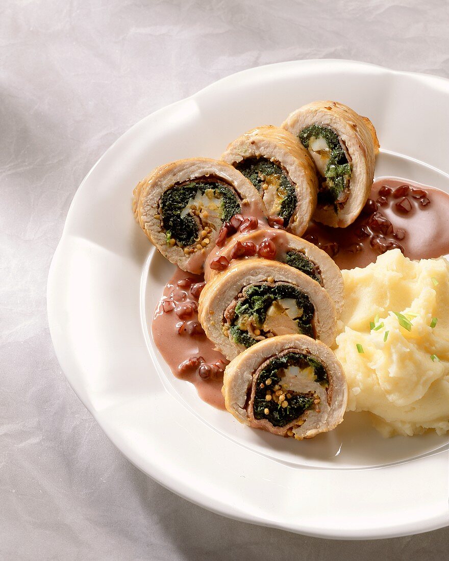 Chicken breast roulades stuffed with spinach,pomegranate sauce