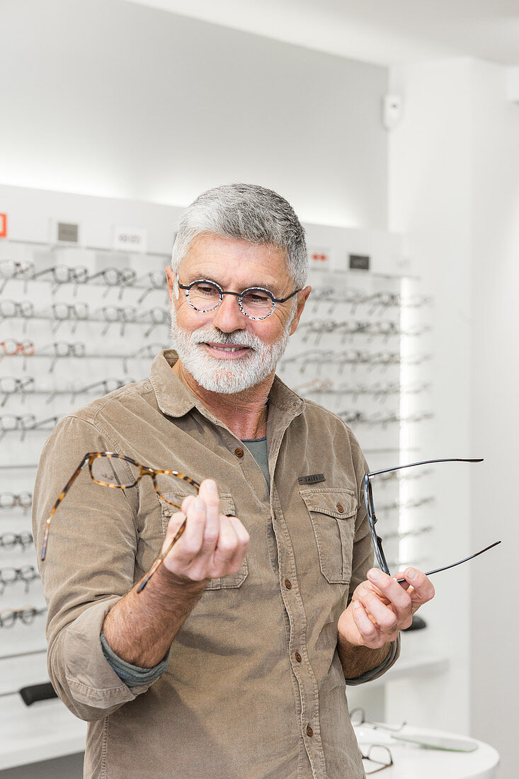 Man trying prescription glasses