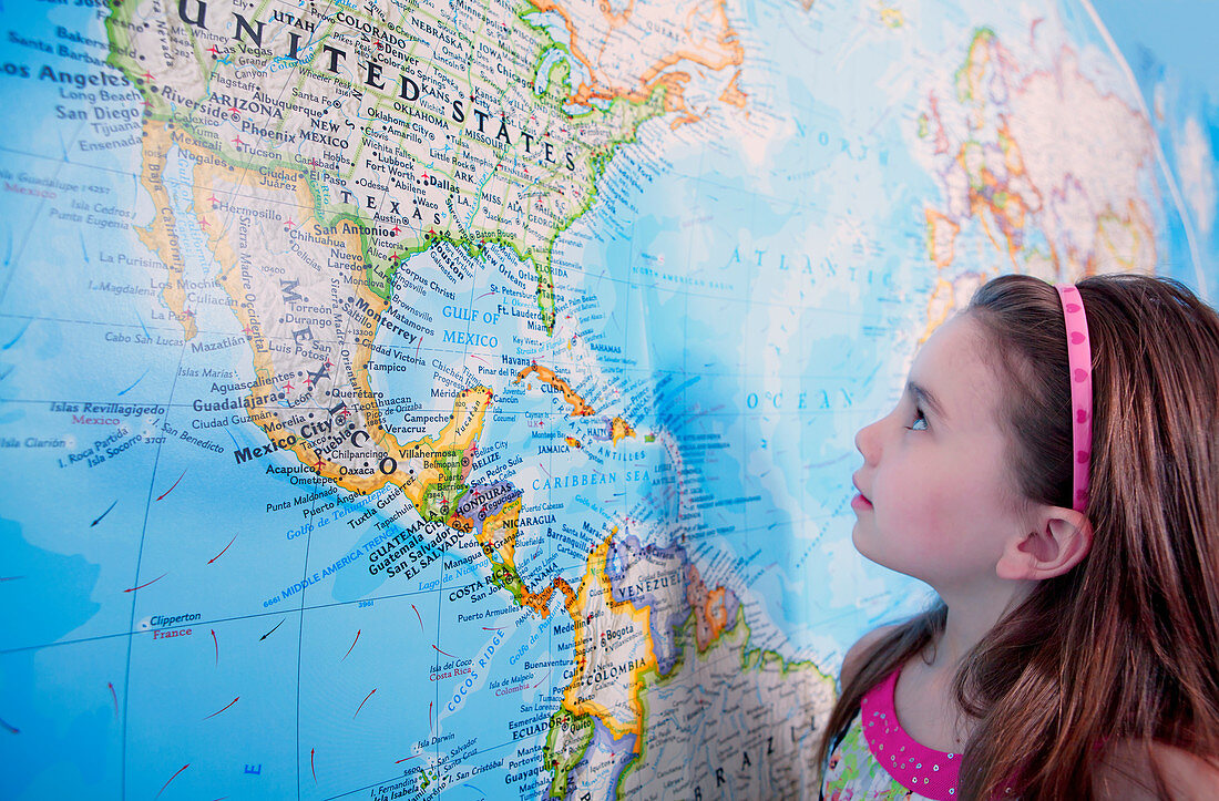 Girl looking at map of the USA