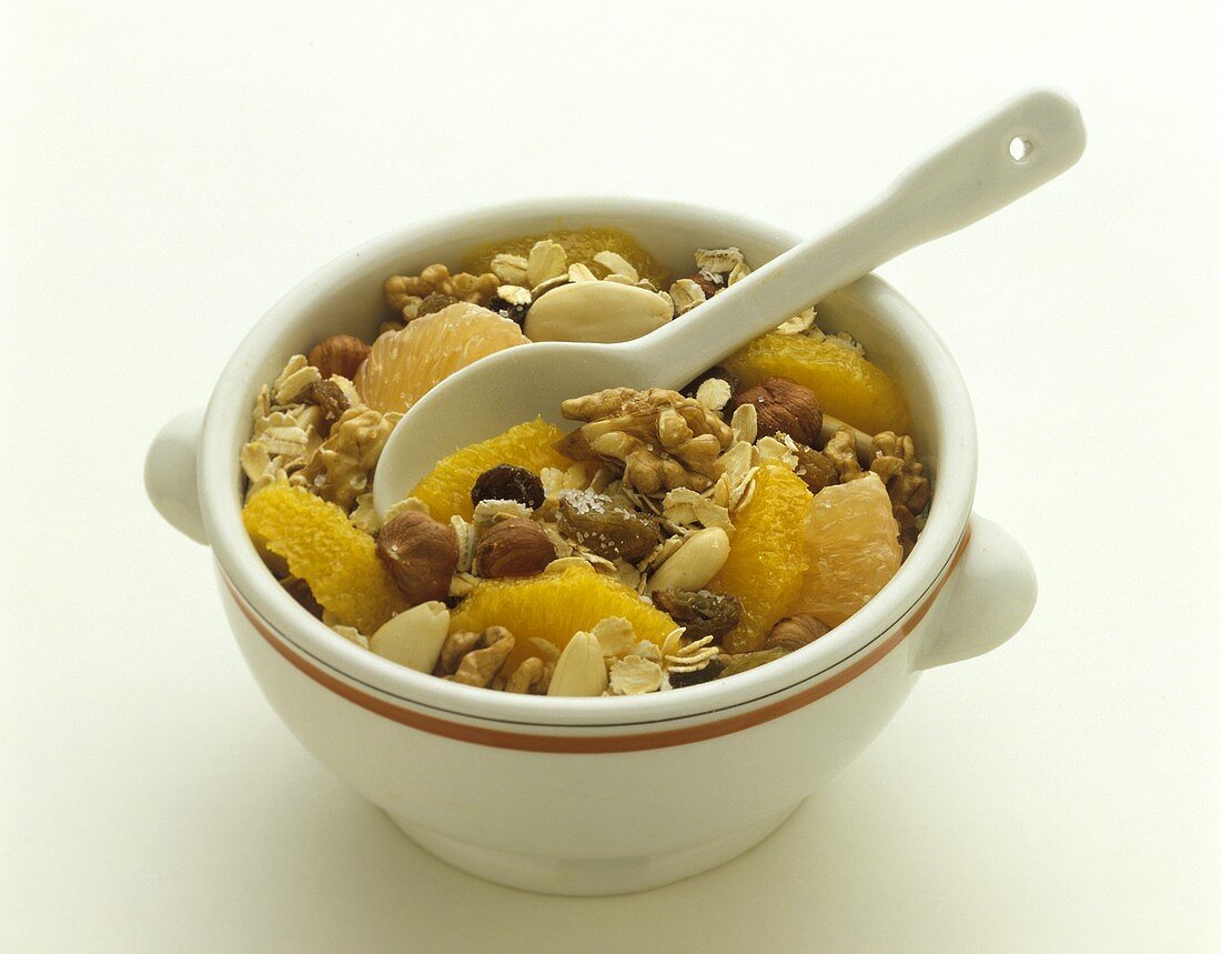 Oat muesli with oranges and grapefruits in a bowl