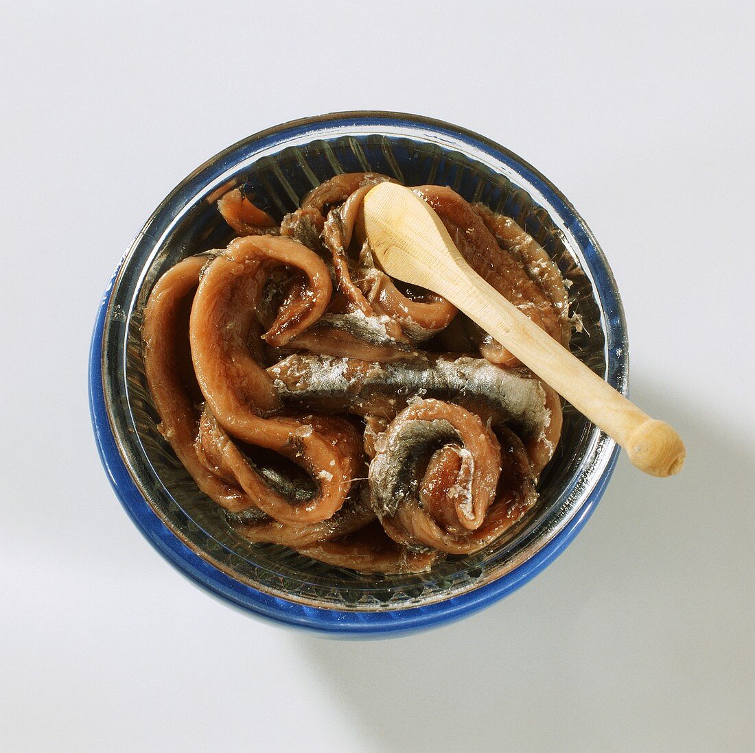 Anchovies in a Bowl; Wooden Spoon