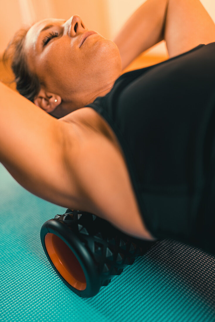 Foam roller back stretching