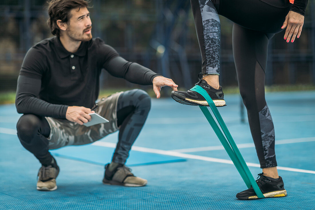 Woman exercising with resistance band