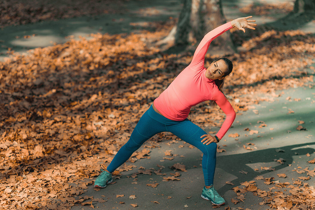 Woman stretching in a park