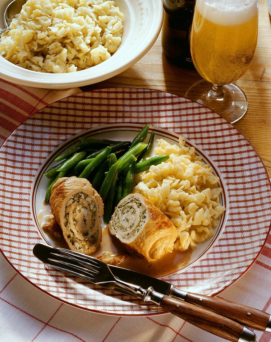 Veal roulades with herb & egg stuffing, beans & noodles