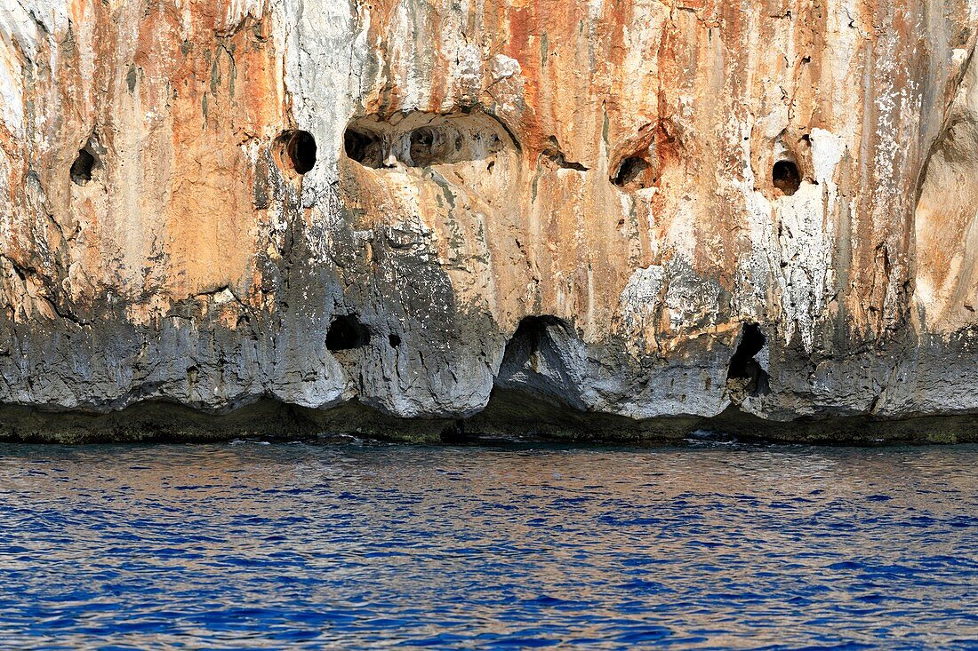 Caves in a sea cliff on Sardinia,Italy