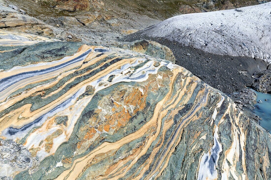 Variegated metamorphic rocks and glacier