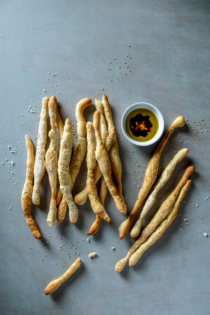 Bread sticks with sesame seeds and olive oil