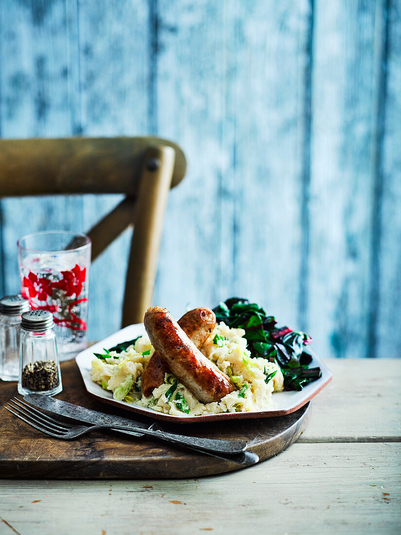 Herby sausages with butter bean mash