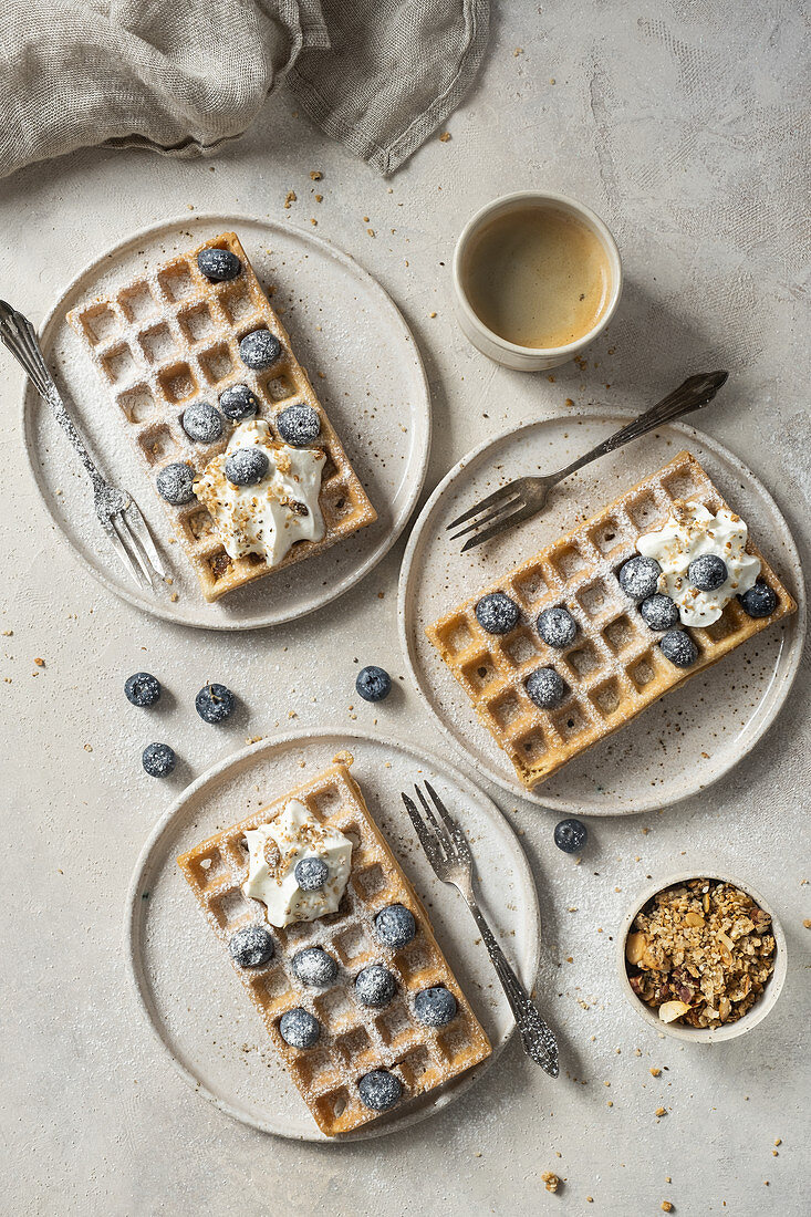 Gluten-free waffles with blueberries and whipped cream