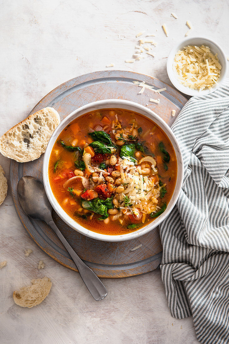 Italian ribollita soup with tomatoes, garlic, beans, spinach and thyme