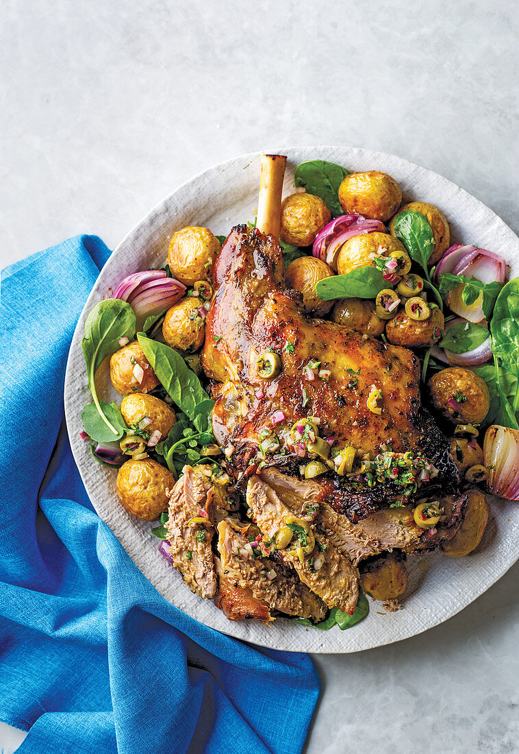 Slow-roasted leg of lamb with olive and anchoy salsa