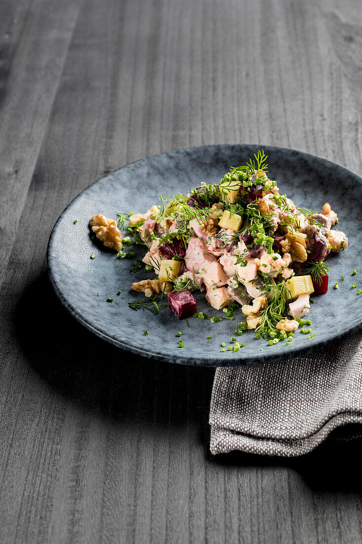Herring salad with beef, beetroot, walnut, gherkins, dill, chive and apple