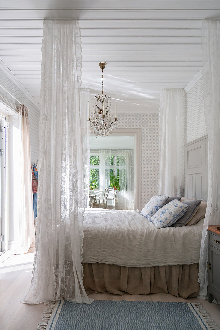 Romantic bedroom in Scandinavian style with canopy