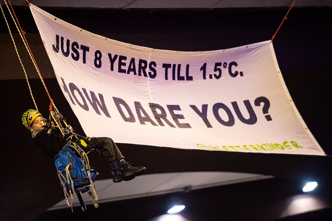 Child abseils with climate change protest banner, 2019