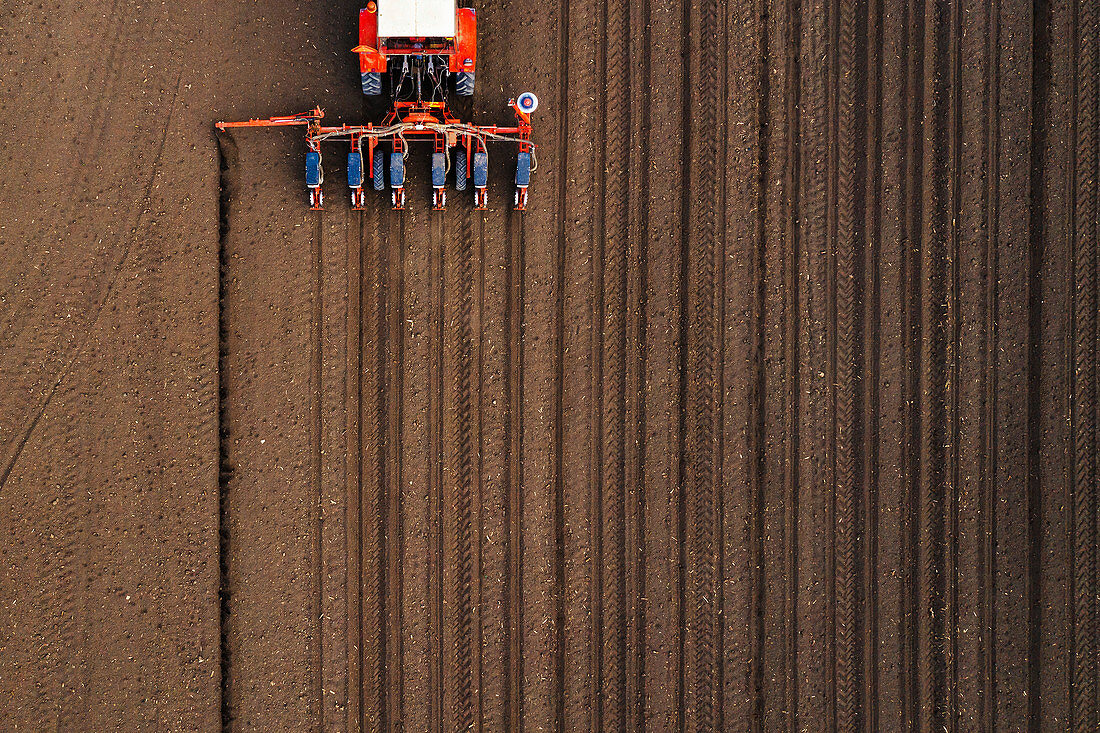 Aerial view of tractor with mounted seeder