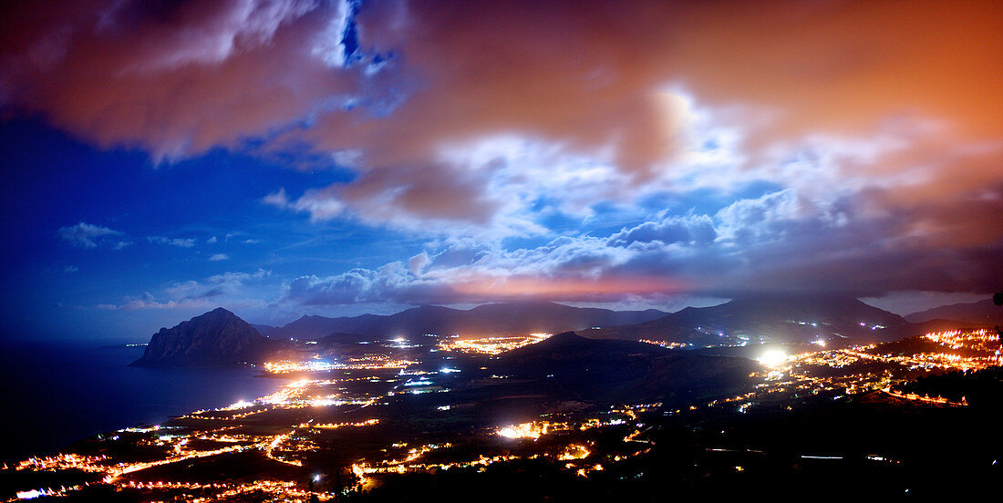 Coastal town at night, aerial view