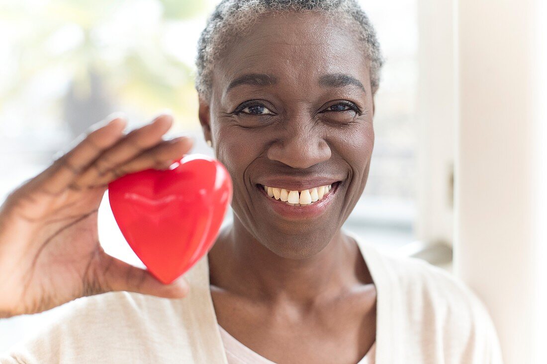 Woman holding heart shape