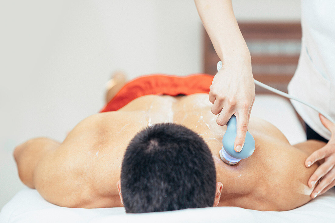 Physiotherapist using ultrasound