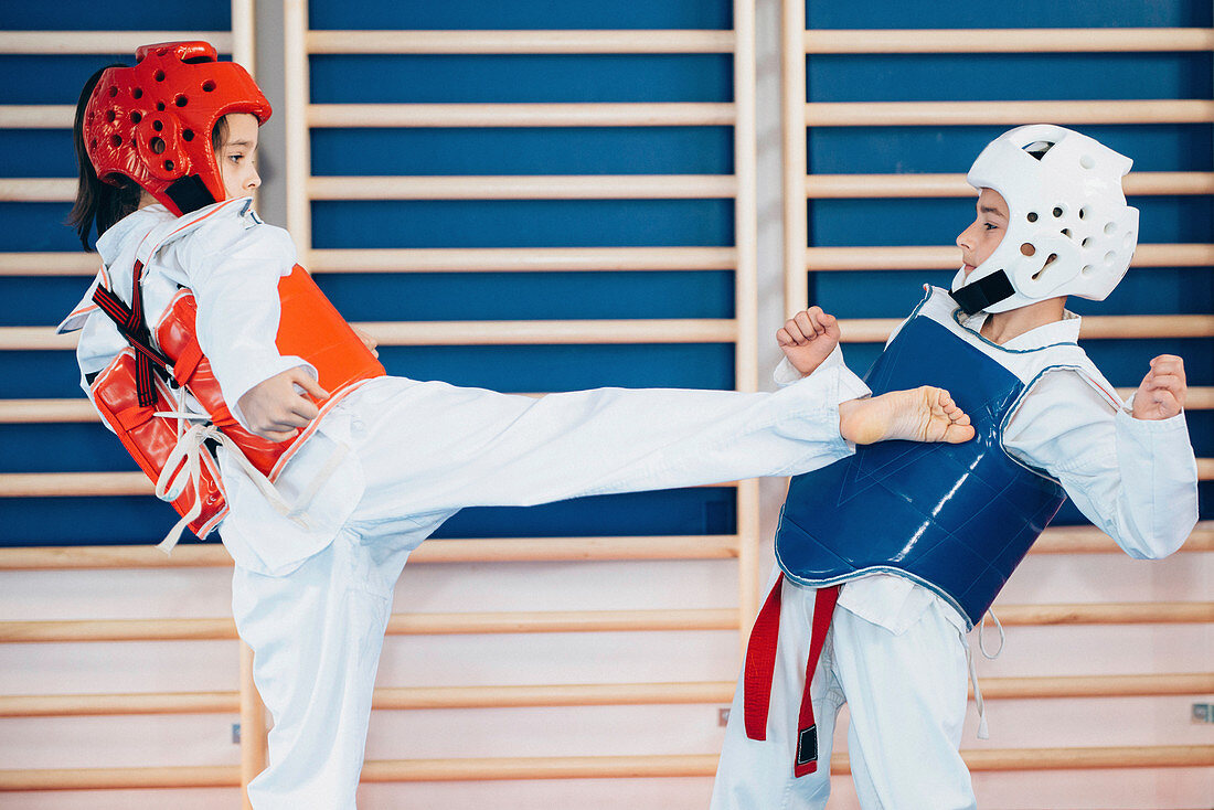 Children sparring in taekwondo class