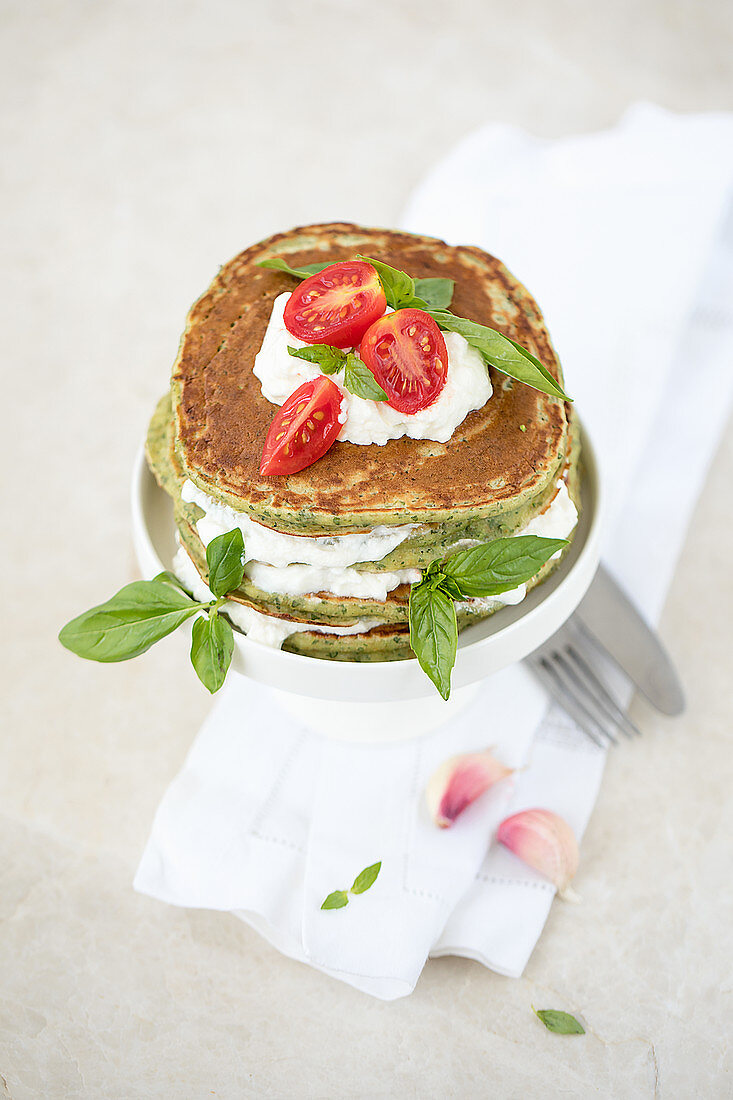 Spinach pancakes with ricotta and cherry tomatoes