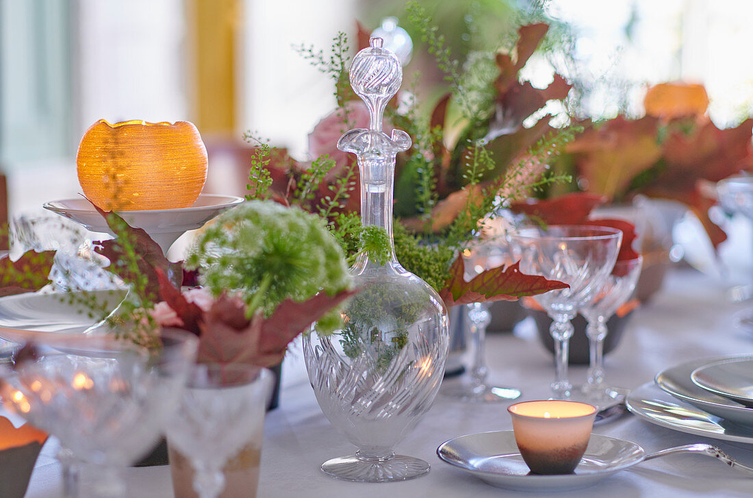 A festively laid table with autumnal decorations