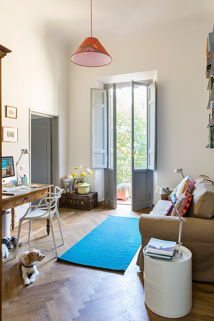 Sofa and desk in study in period apartment