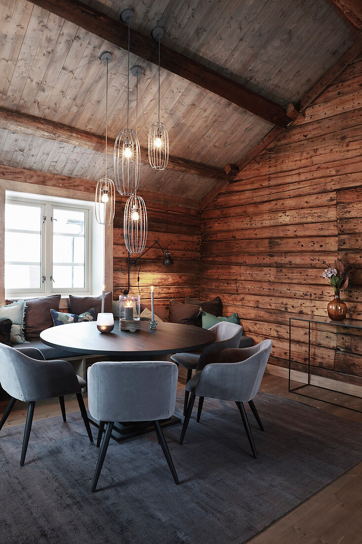 Pleasant and elegant dining room in rustic wooden cabin