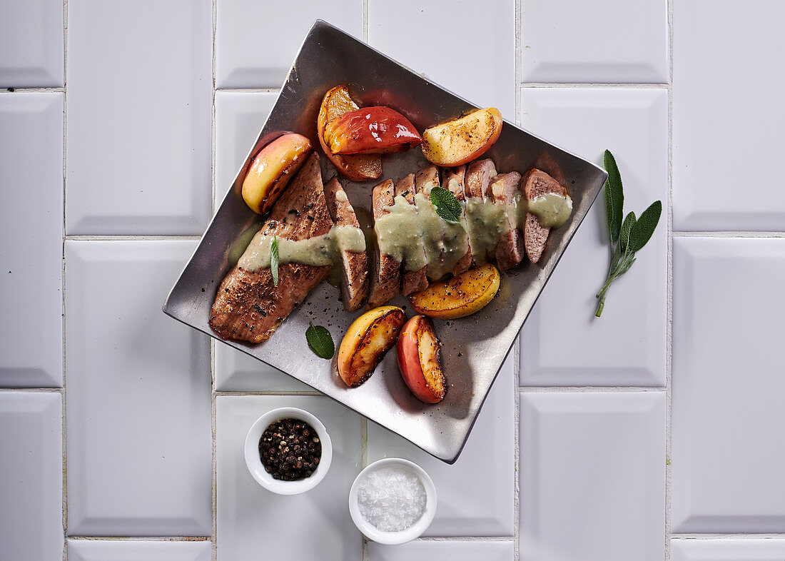 Pork fillet, apple and sage tray bake with blue-cheese sauce