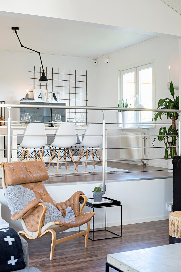 Split-level open-plan interior with view into dining room