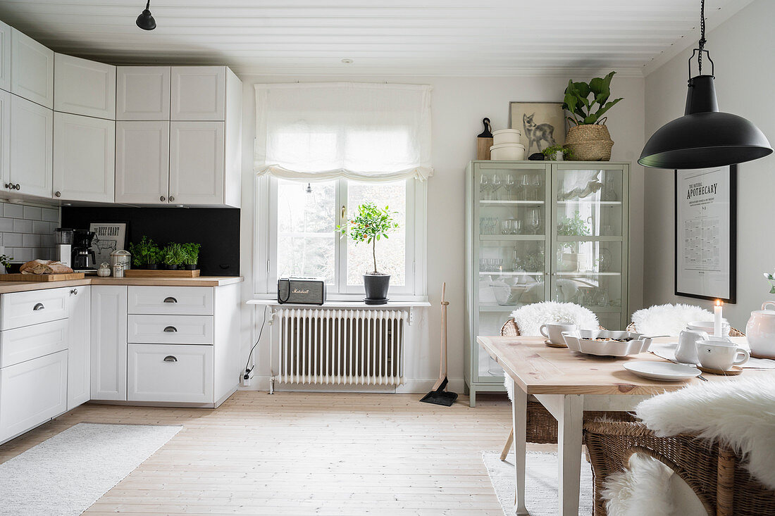 Large kitchen-dining room in Scandinavian country-house style