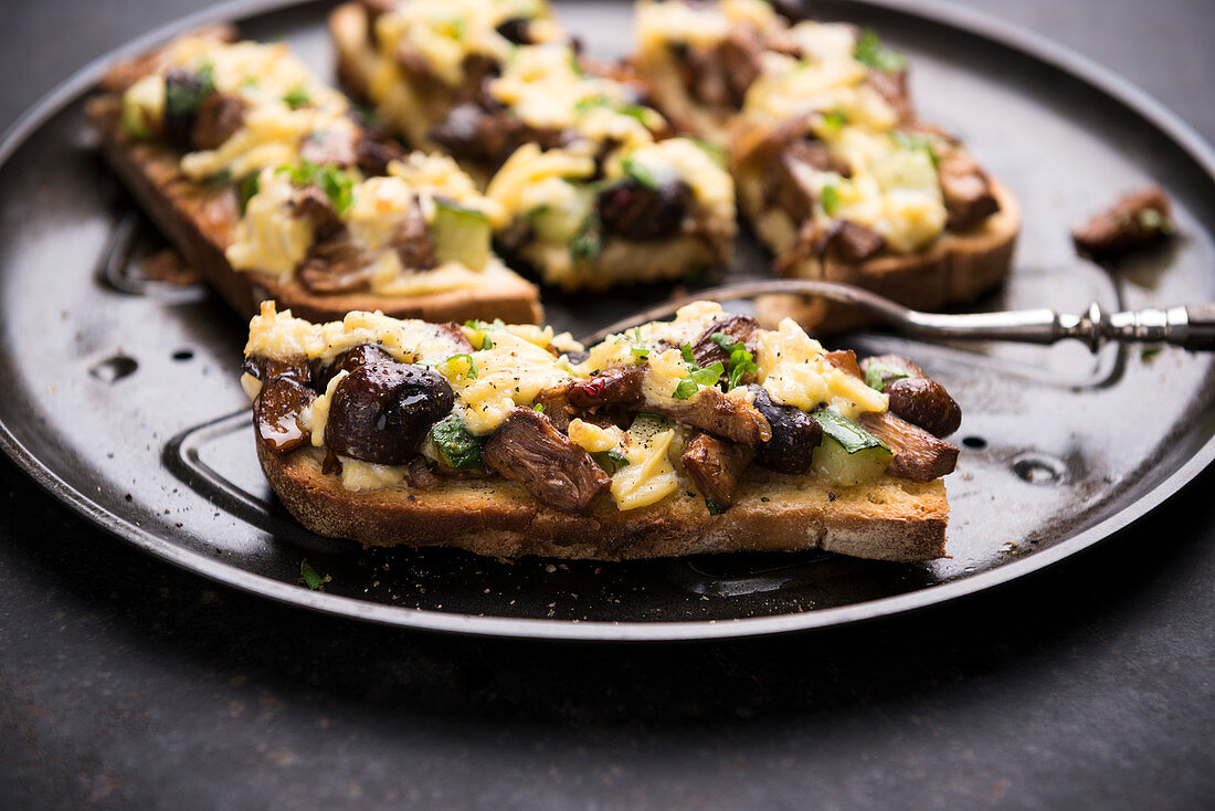 Bruschetta with jackfruit, wild mushrooms, cucumber, topped with grilled vegetable cheese (vegan)