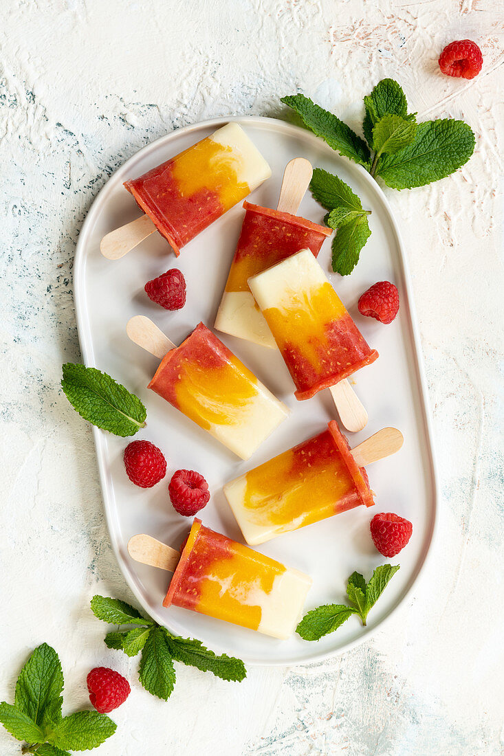 Vegan mango raspberry popsicles