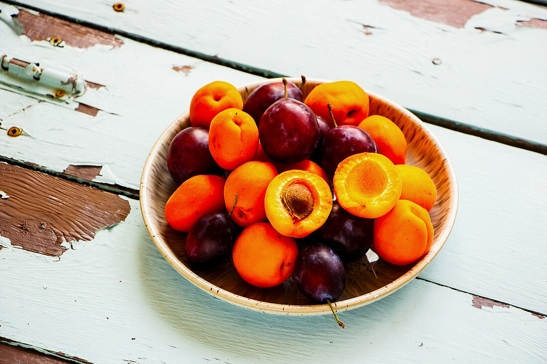 Organic summer fruit on wooden table