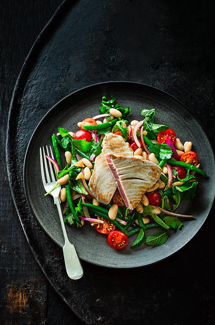 Tuna steak with bean salad and preserved lemon dressing