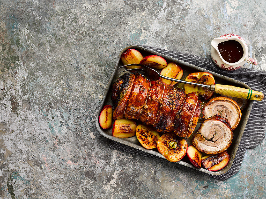 Roast belly pork with sage, cider and caramelized apples