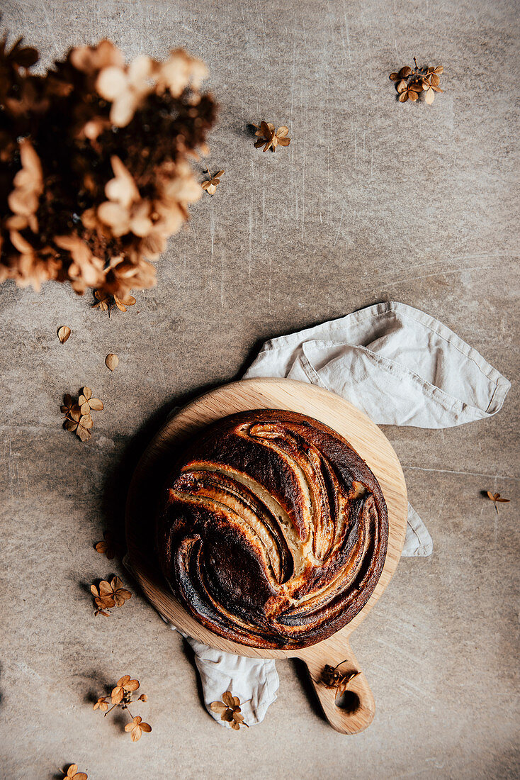 Banana bread on a wooden board (top view)