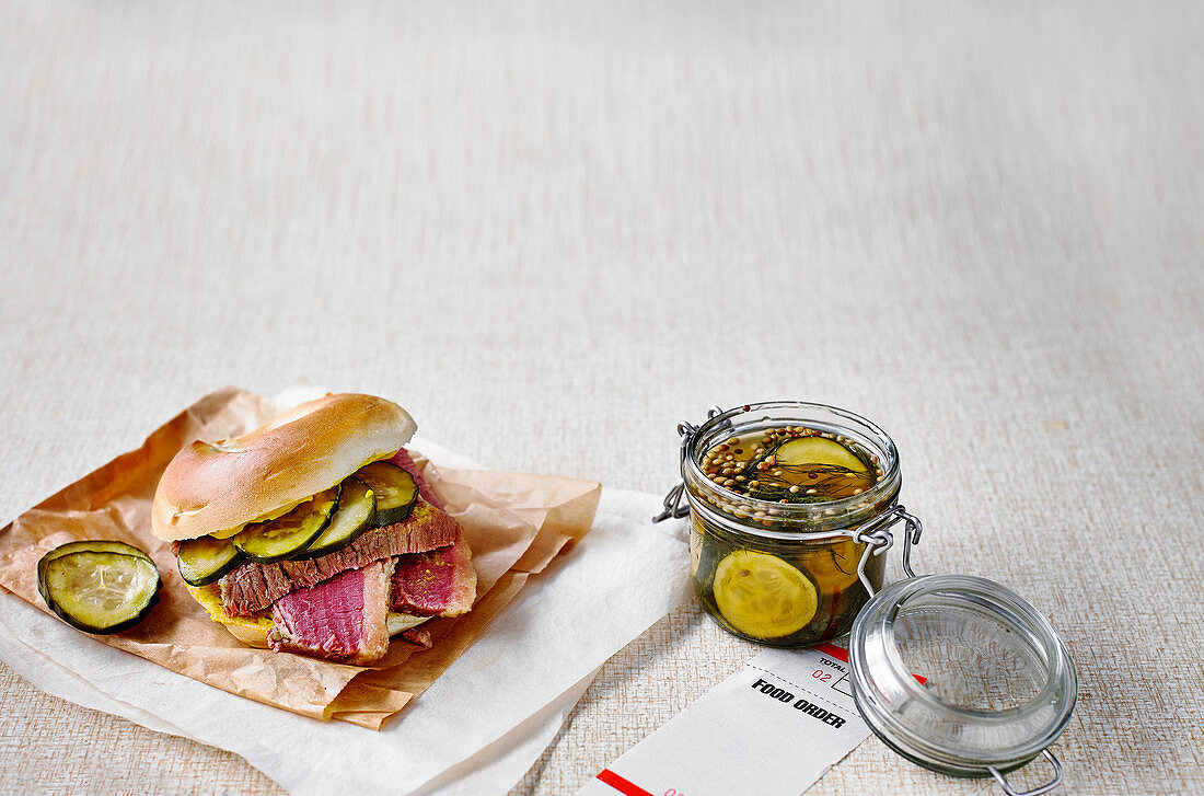 Bagels filled with salt beef and dill pickles