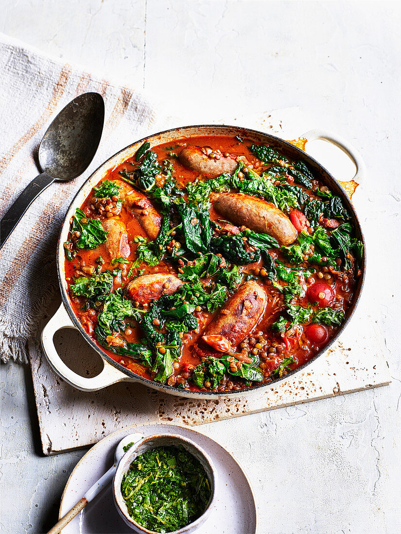 Sausages and braised puy lentils with kale